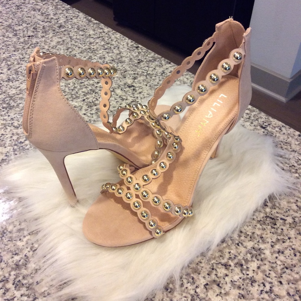 Nude and gold studded heels.